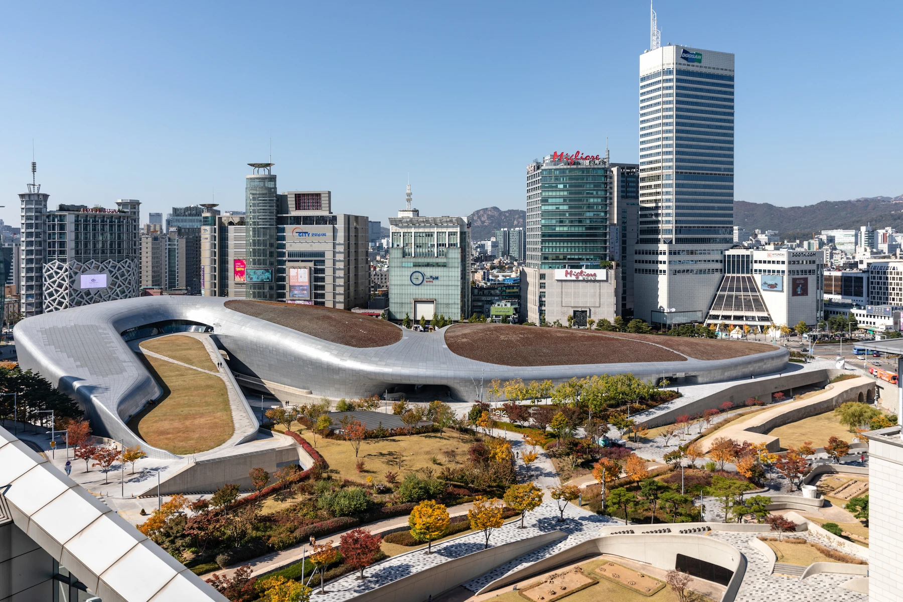 Daytime view of Dongdaemun Design Plaza and the surrounding shopping district in Seoul