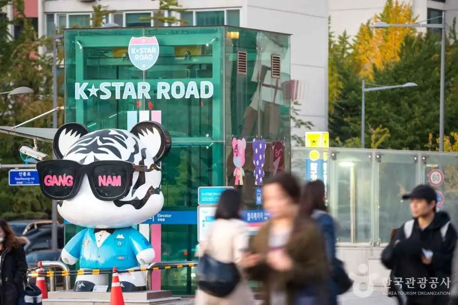 GangnamDol figure and K-Star Road sign in Gangnam, Seoul