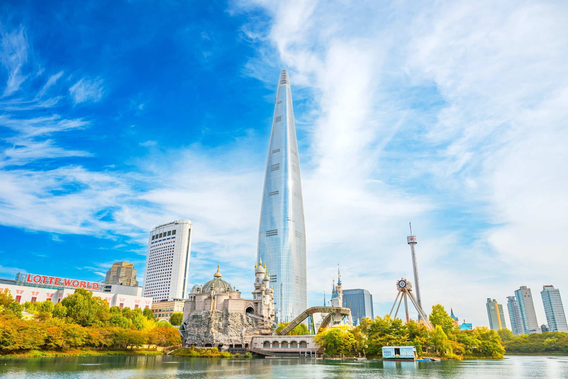 Jamsil skyline with Lotte World Tower, Magic Island and Seokchon Lake in Seoul.