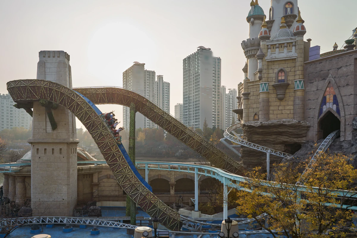 Outdoor roller coaster and Magic Castle at Lotte World