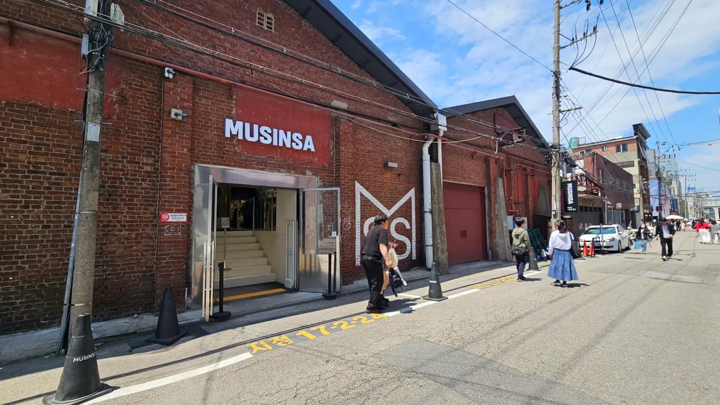 Red-brick Musinsa retail space in a former industrial building in Seongsu, Seoul.